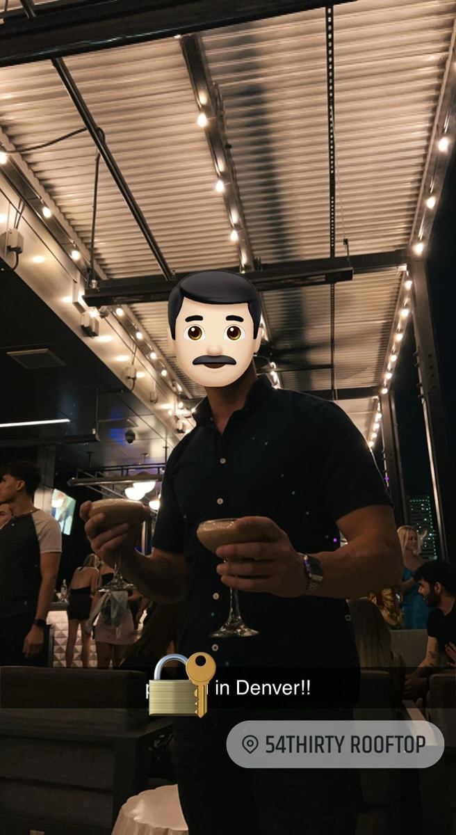 Paul at the 54thirty rooftop bar with the Denver skyline